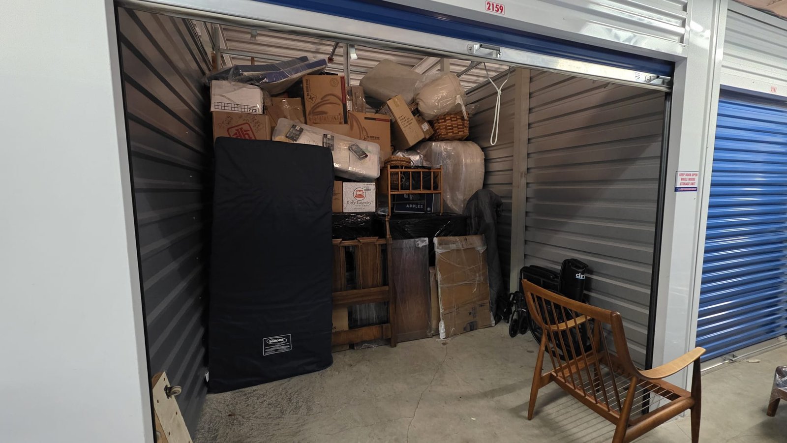 Secure storage unit loaded with wrapped furniture by Always Best Moving